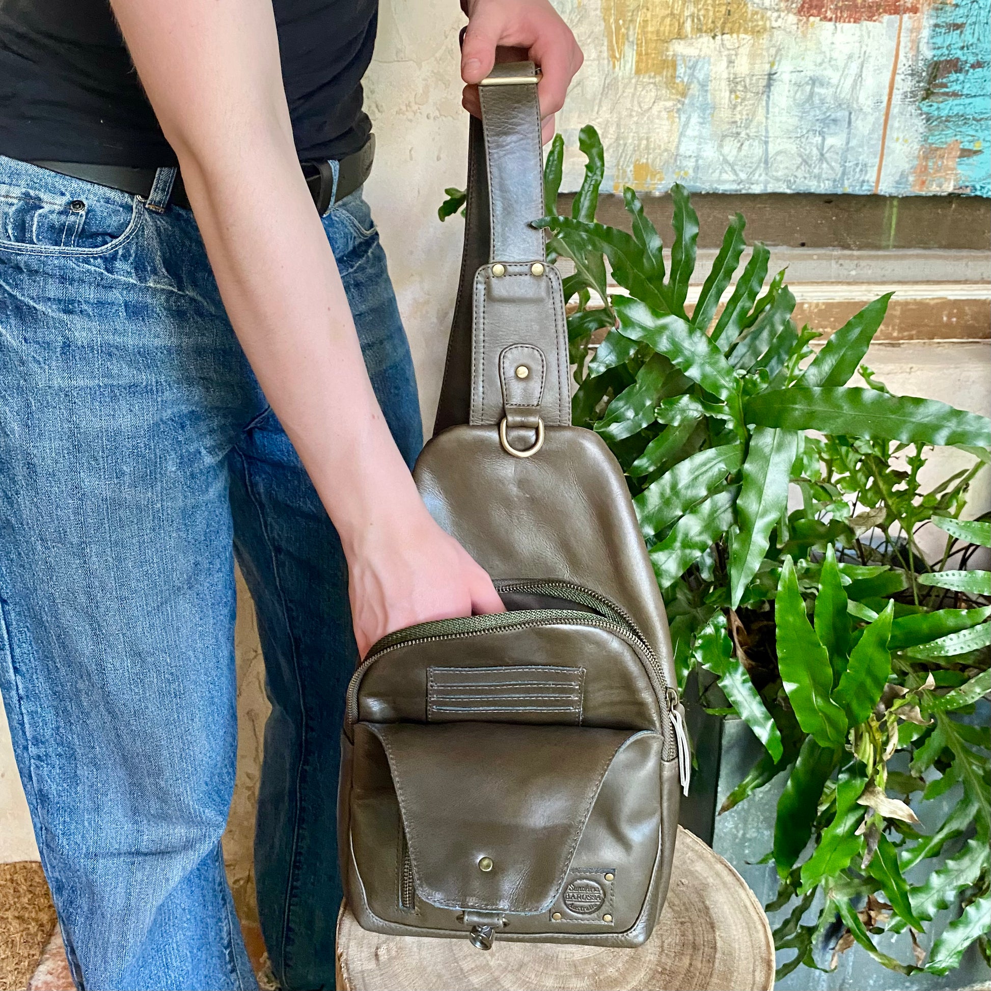 Green leather sling sales bag