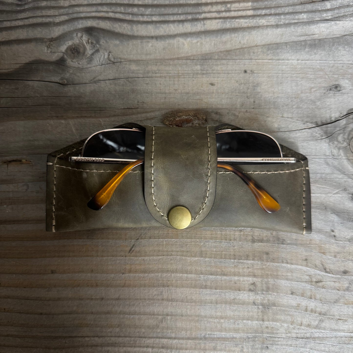 A Thin Leather Snap Lock Glasses Case