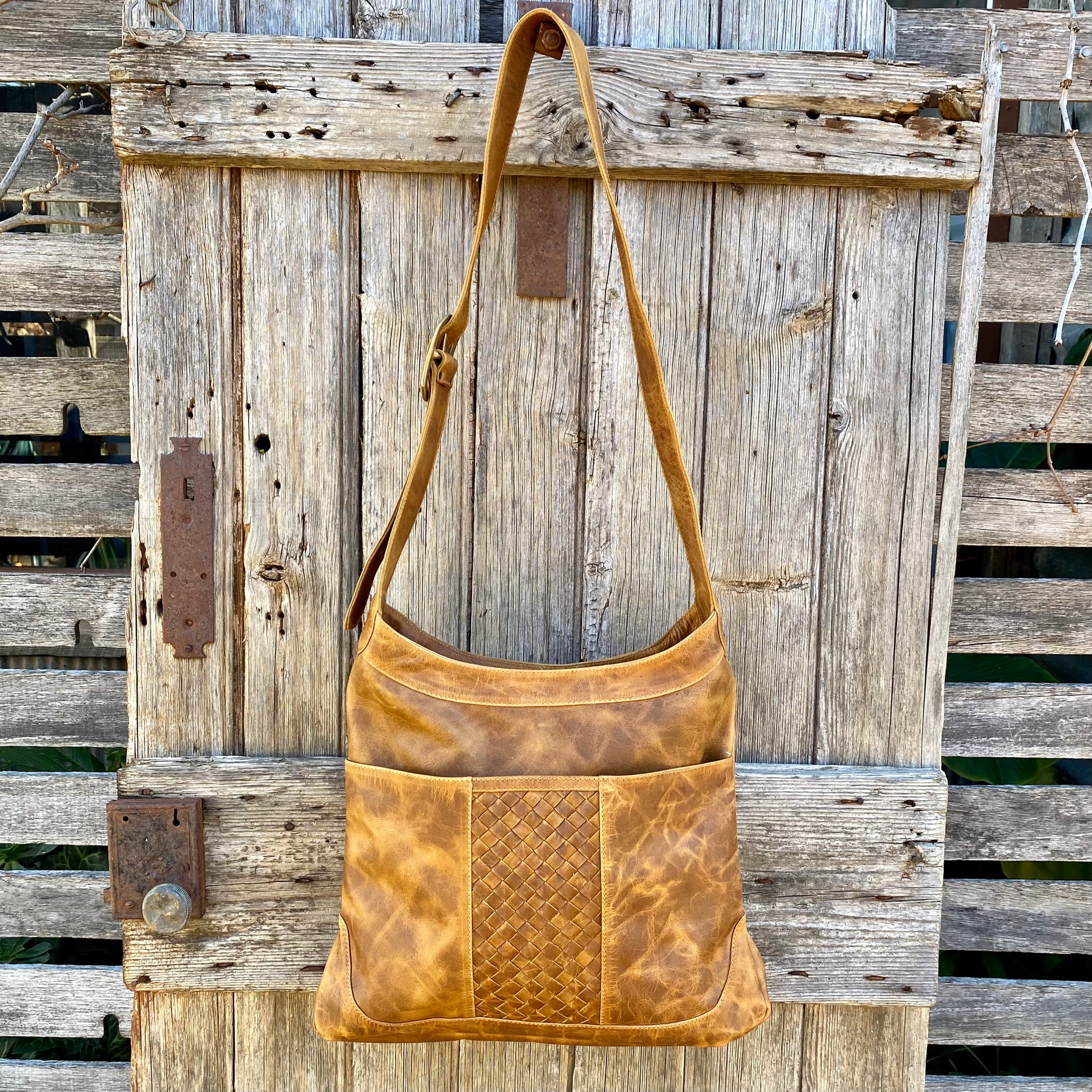 Wide strap top leather handbag